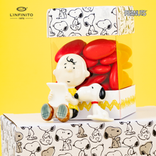 将图片加载到图库查看器，Calamita di Charlie Brown che legge insieme a Snoopy
